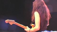 V.J. playing a Fender Strat