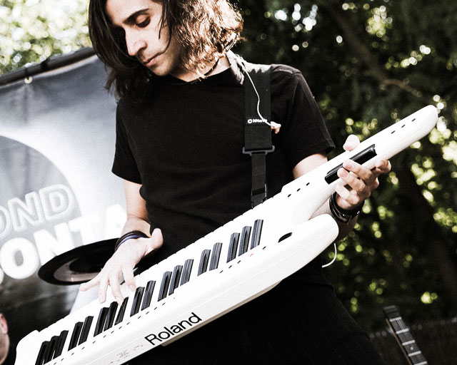V.J. performing a Roland AX-7 keytar