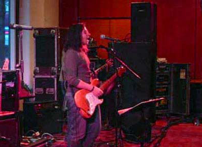 V.J. playing a Fender Strat