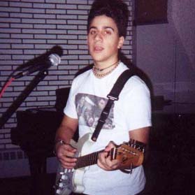 V.J. playing a Fender Squier Strat