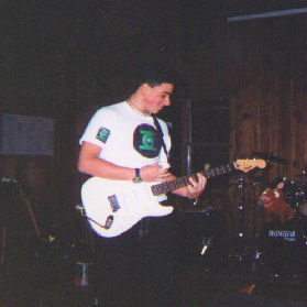 V.J. playing a Fender Squier Strat